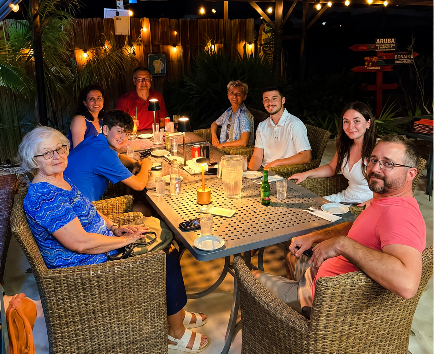 A group of guests enjoying dinner together at Battata Beach Bar & Food at night